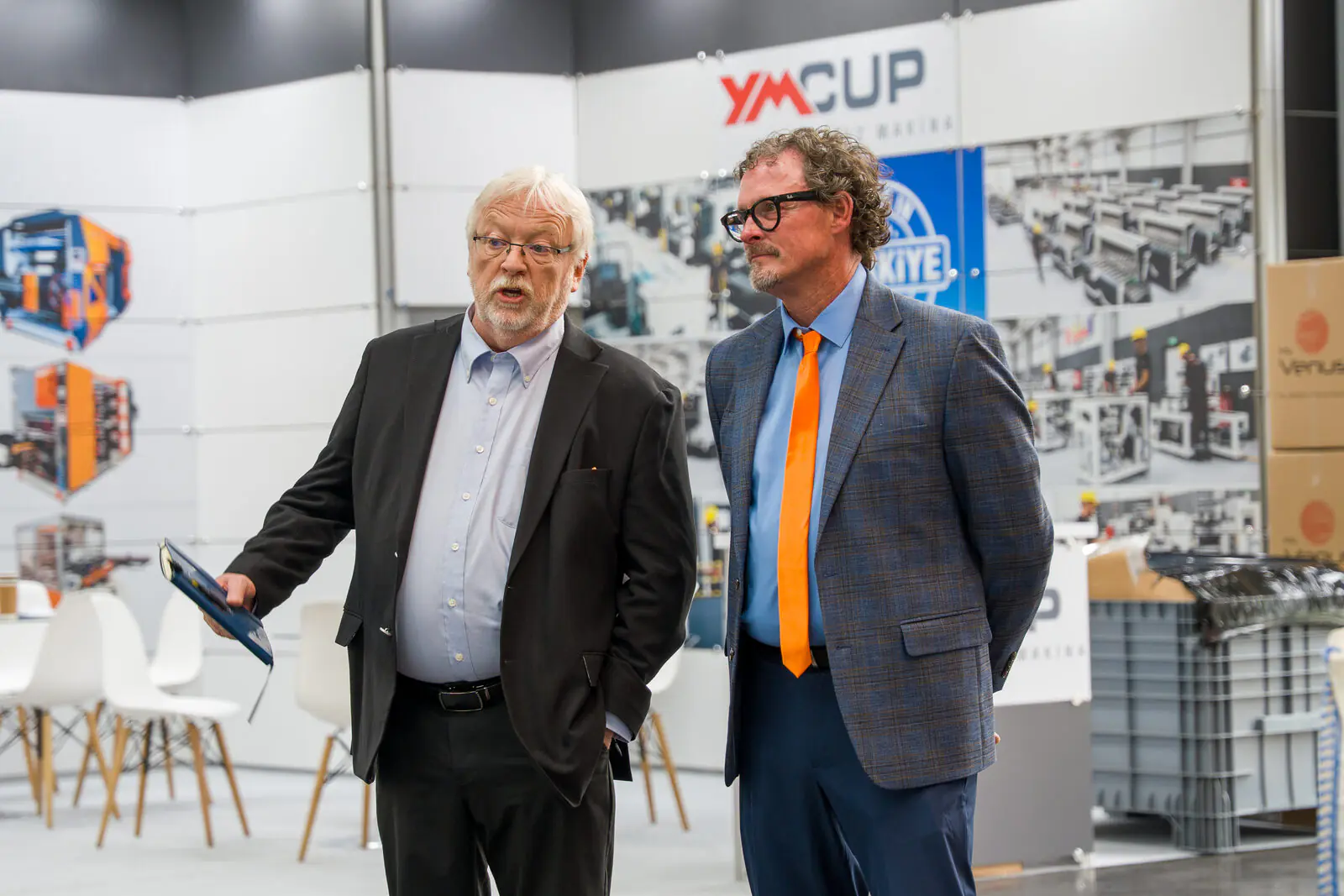 Business conversation at the Newlong booth, Interpack 2026