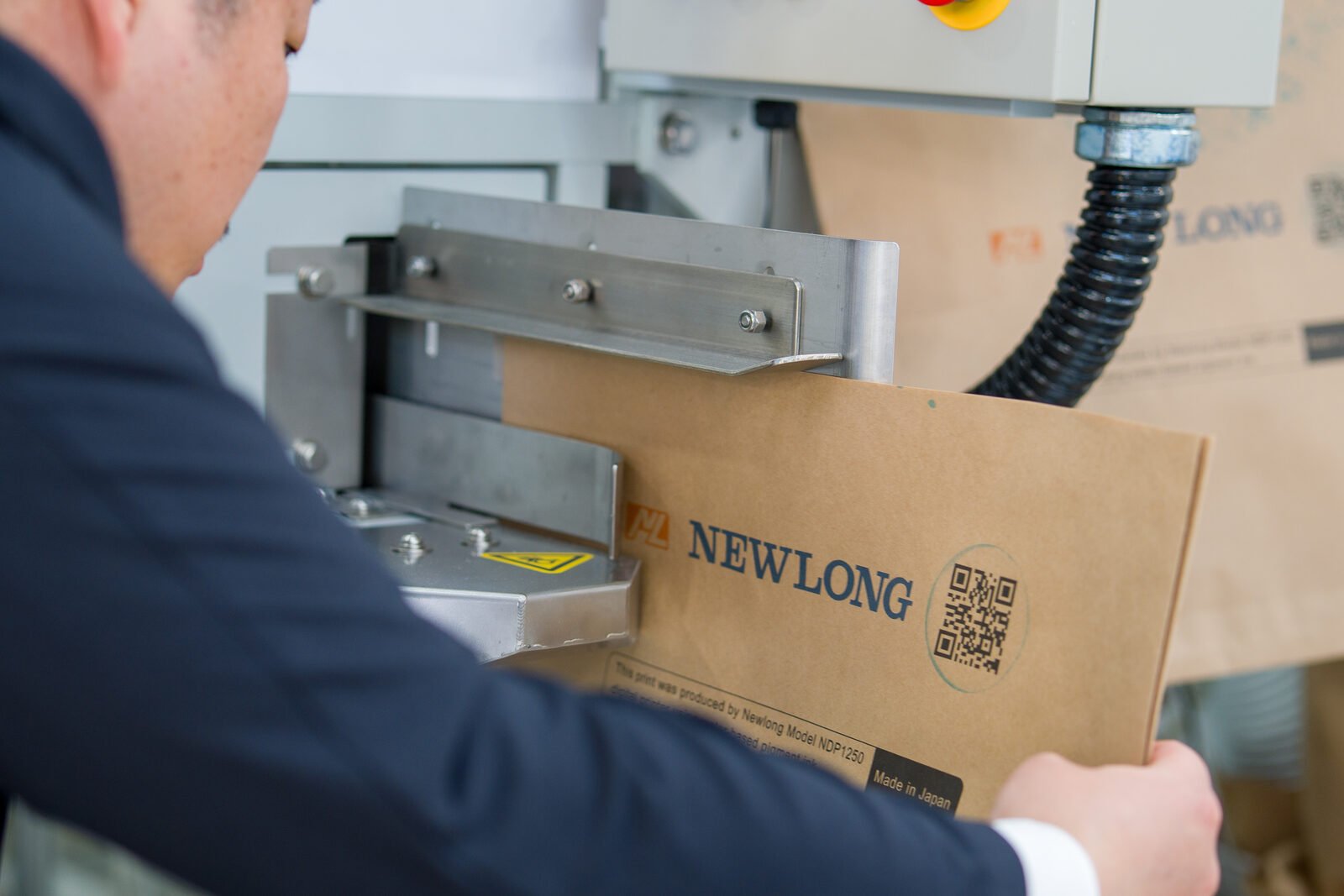 Detailaufnahme eines Newlong-Papiersacks mit QR-Code