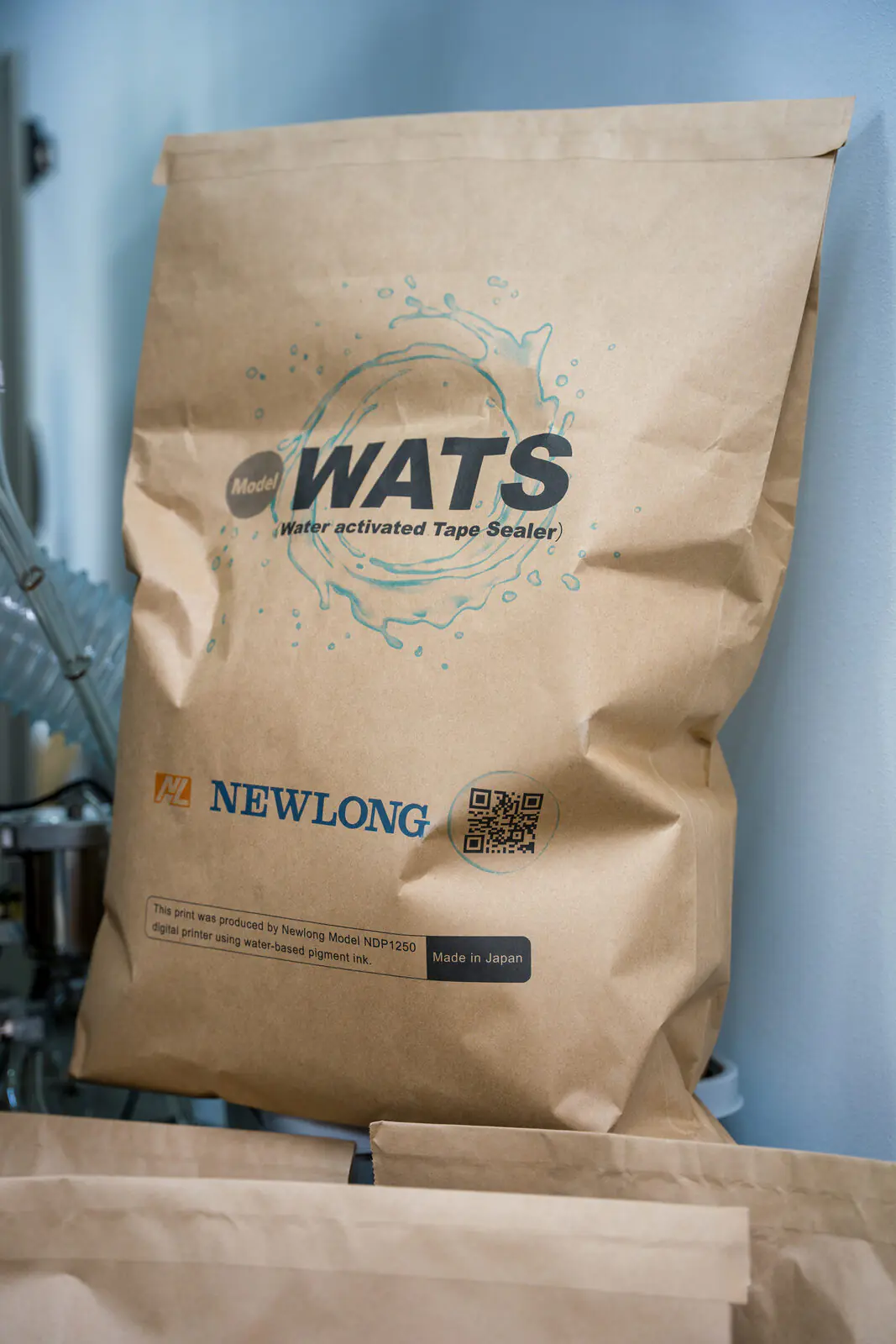 Watts water-activated tape sealer paper bag at the Newlong stand